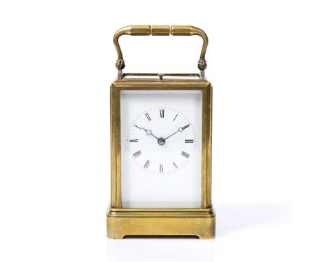 A FRENCH BRASS REPEATER CARRIAGE CLOCK with white enamel dial and Roman numerals, 12cm high ex handle