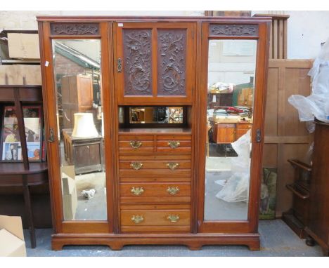 CARVED ANTIQUE MAHOGANY COMBINATION TRIPLE WARDROBE 