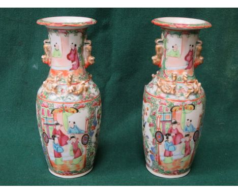 PAIR OF CANTONESE STYLE HANDPAINTED AND GILDED CERAMIC VASES DECORATED IN THE TYPICAL MANNER, APPROXIMATELY 26cm HIGH 