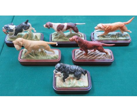 SET OF SIX ROYAL WORCESTER 'SPORTING DOG' SERIES UNGLAZED CERAMIC FIGURES ON WOODEN STANDS (SOME AT FAULT) 