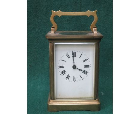 FRENCH STYLE BRASS AND GLASS CARRIAGE CLOCK WITH ENAMELLED FACE