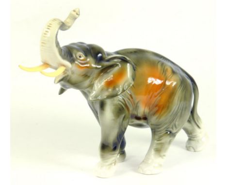 A ROYAL DUX PORCELAIN MODEL OF AN ELEPHANT