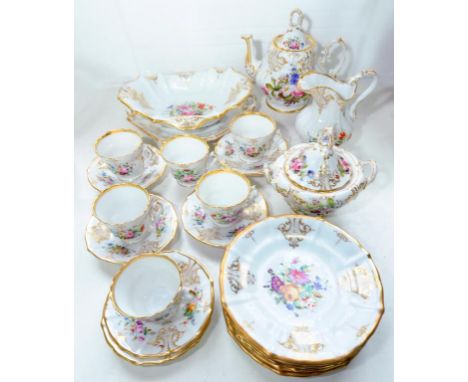 A MID 19TH CENTURY FRENCH PORCELAIN TEA SERVICE PAINTED WITH BRIGHTLY COLOURED GROUPS OF FLOWERS AND RICHLY GILT, THE SERVICE