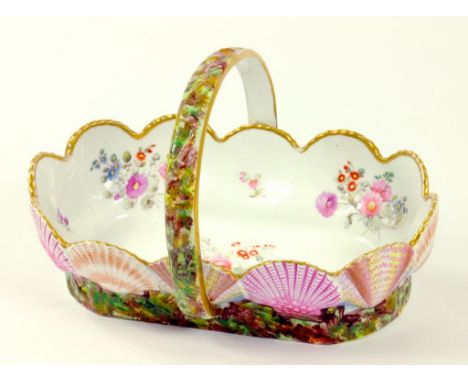 A SPODE BONE CHINA SCALLOP SHELL BORDERED BASKET DECORATED IN BRIGHT ENAMELS AND PAINTED TO THE INTERIOR WITH FLOWER SPRAYS, 