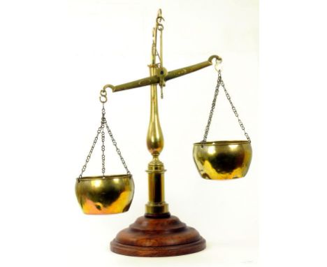 A FRENCH BRASS BEAM SCALE, MARKED ON BEAM DL & CIE, WITH SHEET BRASS PANS ON SWAN NECK BRANCH AND BALUSTER PEDESTAL, WITH SUB