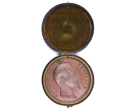 A fine French bronze prize medallion for the 1855 “Exposition Universelle”, 60mm diam, the obverse with bust of “Napoleon III