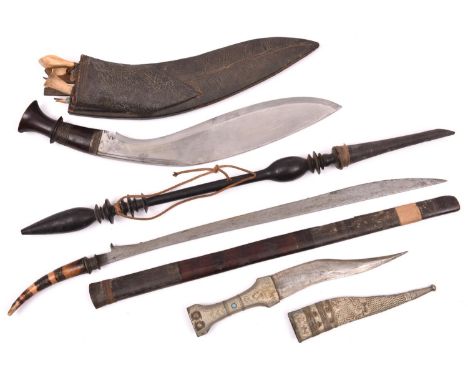 A Malaysian Bade Bade type knife or short sword, slender wedge shaped SE blade 18½”, the hilt formed from the tip of a small 
