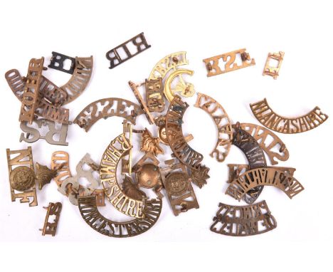 30 mostly brass Infantry shoulder titles, including large WM R-S (x2), pair small brass RS, Queens Own Buffs, N/grenade/F (x2