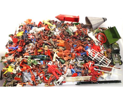 Quantity of plastic toy soliders, cowboys, Indians etc, various makes plus Britians metal cart and crescent tractor unit US a