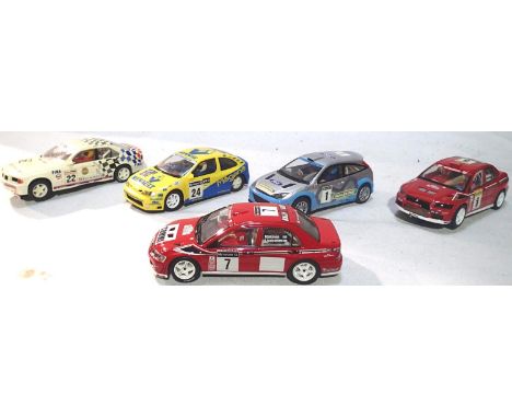 Five Slot cars comprising of Auto Art 4 wheel drive Mitsubishi and four Scalextric, mostly in very good condition, missing sp