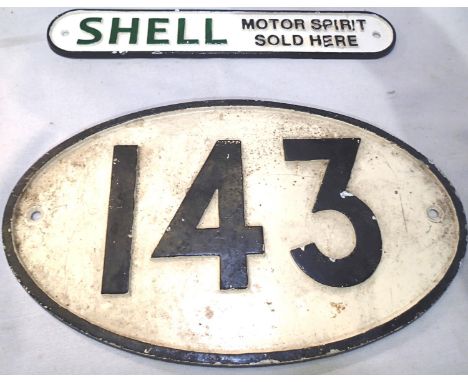 Two cast metal signs, oval 143 30 cm and Shell Motor Spirit 30 cm. P&amp;P Group 1 (£14+VAT for the first lot and £1+VAT for 