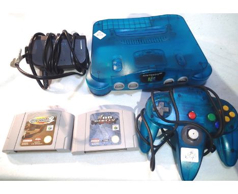 Nintendo N64 control deck, model NUS-001, with one controller (no power supply), and two game cartridges: WWF No Mercy and To