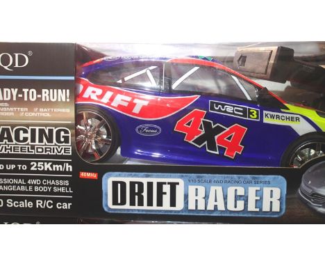 N.Q.D 1/10 scale Drift Racer, radio control in very good condition, boxed. P&amp;P Group 1 (£14+VAT for the first lot and £1+