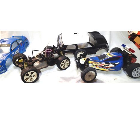 Two radio control cars, Tamiya electric buggy and IC engine chassis, plus two bodyshells. P&amp;P Group 2 (£18+VAT for the fi