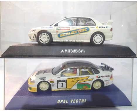 Two Scalextric rally cars to include Mitsubishi and Opel Vectra both in very good to excellent condition, in plastic boxes. P