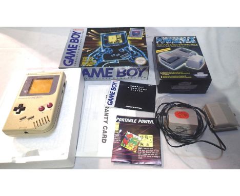 Nintendo Gameboy: handheld game system, c.1989, boxed, no battery cover, with an aftermarket rechargeable battery pack, also 