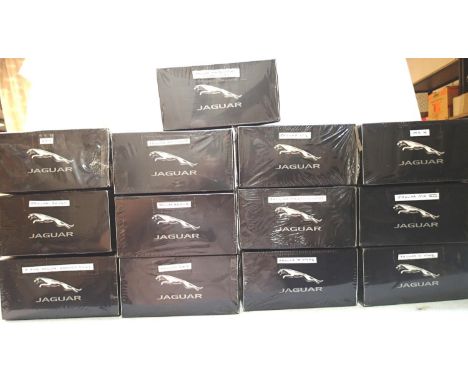 Thirteen Atlas Editions Jaguar Collection, all factory sealed, but have identity labels attached, some have storage wear. P&a