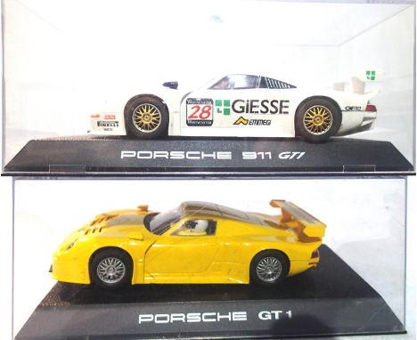 Two Scalextric GT 1 cars to include Porsche 911 GT 1 and Porsche GT1 yellow, both in excellent condition, in plastic boxes. P