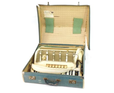 A Hohner Pirola III piano accordion, 120 button, cased.  (AF)