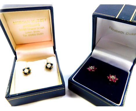 A pair of 9ct gold cultured pearl and sapphire floral earrings, together with a pair of 9ct gold ruby and diamond floral earr