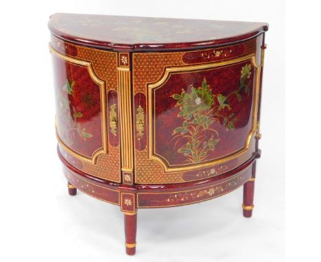 A Chinese red lacquer demi lune side cabinet, painted with birds and flowers, having two doors opening to reveal a single she