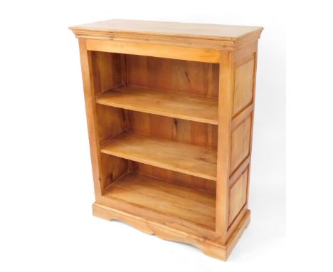 A pale mango wood open bookcase, of two shelves raised on a bracket plinth base, 120cm high, 94cm wide, 40cm deep.