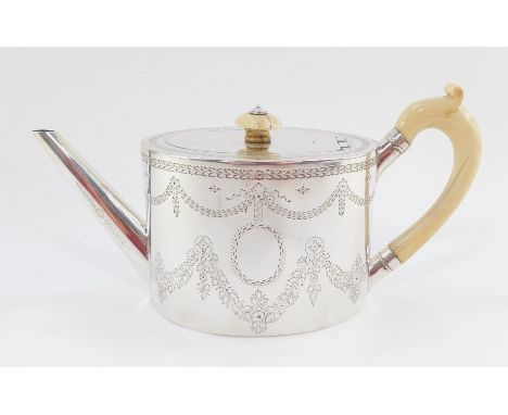 A Victorian silver teapot, the oval body with ivory handle and knop, plain spout, chased with garlands and flowers, with vaca