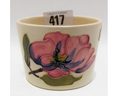 Moorcroft Pottery pink magnolia decorated oval section small vase with cream ground, printed marks to the base, height 6cm