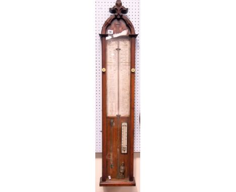 A Victorian oak cased combination barometer by Admiral Fitzroy with arched carved top and surmount, height 116cm