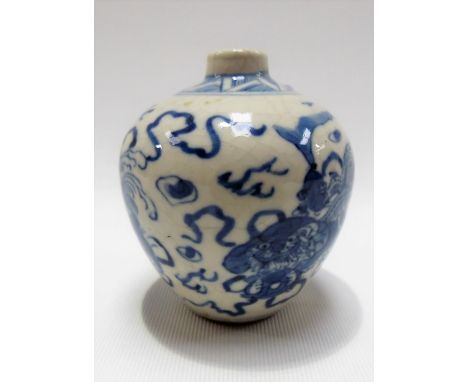 Chinese blue and white underglaze decorated ovoid bud vase decorated with three Chinese dogs with balls at their feet amongst