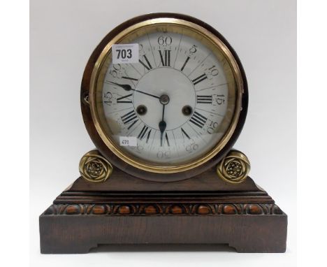 19th Century oak drumhead two train mantle clock, the 6in white enamel dial with Roman numerals on the hours and Arabic on th