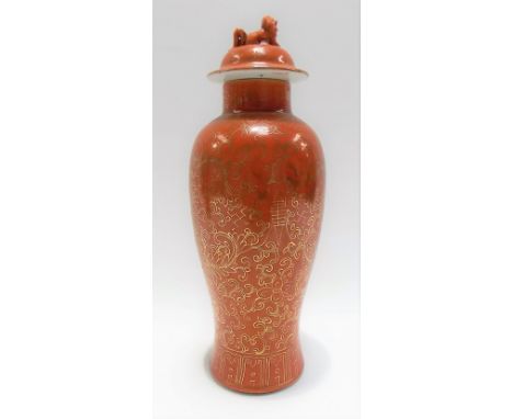 Chinese porcelain baluster vase and cover gilt decorated with foliate scrolls upon an orange ground, height 26cm (chip to lid