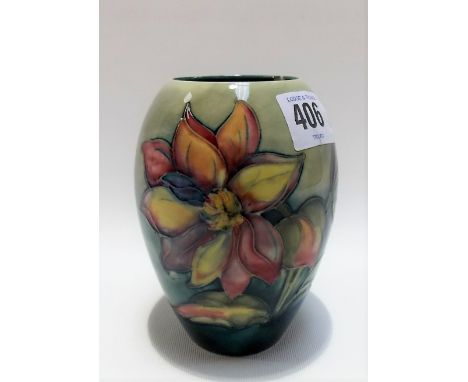 Moorcroft Pottery clematis tubeline decorated vase with green blush ground, impressed marks to the base, height 12cm (chip to