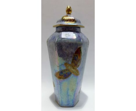 Wilton ware hexagonal tapered lidded vase decorated with moths and butterflies upon a purple mottled ground, height 31cm.