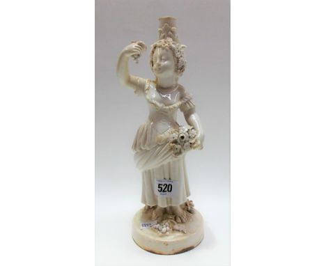 19th Century Staffordshire porcelain white glazed figural candlestick base modelled emblematic of summer, holding flowers and
