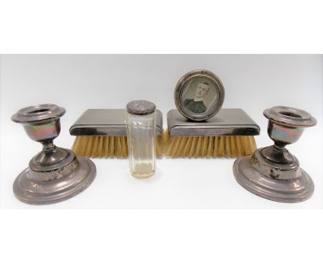 Hallmarked silver items to include a pair of engine turned hair brushes, a pair of squat candlesticks (af), a small circular 