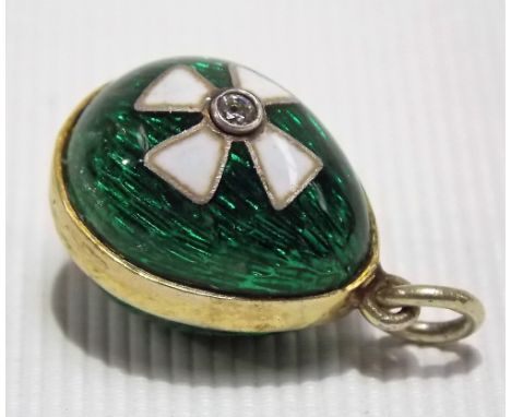 A Faberge style yellow metal green guilloche and white enamel diamond set pendant, length overall 20mm approx