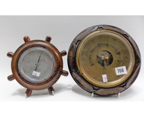 Oak cased aneroid barometer with engraved brass dial, diameter 25cm; together with an oak cased ship's wheel barometer with 3