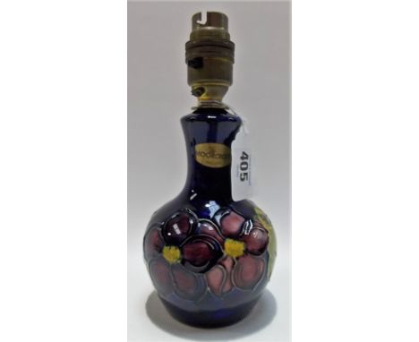 Moorcroft Pottery tubelined small table lamp base decorated with anemones upon a dark blue ground, applied Moorcroft sticker,