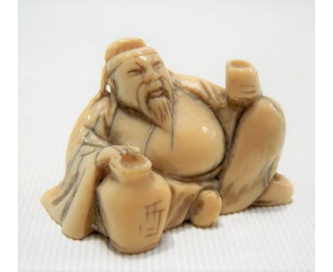 Japanese ivory Meiji period netsuke in the form of a portly seated gentleman with a jug and cup, signed to the base, width 4c