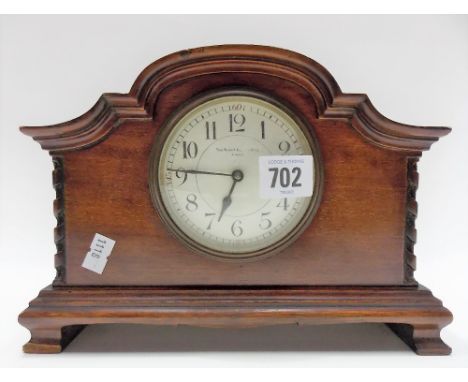 Early 20th Century mahogany case timepiece with 3in enamel dial with Arabic numerals and with French movement, width 24cm
