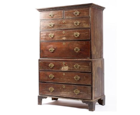 A Georgian mahogany secretaire chest, with dentil cornice above two short drawers and three long graduated doors, above three