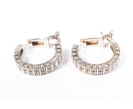 A pair of Boucheron Paris 18ct white gold and diamond hoop earrings, each set with a double line of single cut diamonds, 11.7