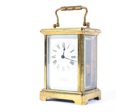 An early 20th century brass carriage clock by H. Greaves (Birmingham), the white enamelled dial with black Roman numerals, wi