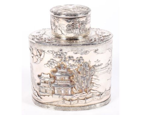 A Chinoiserie white metal oval tea caddy, 20th century, lozenge enclosing seal mark to base, cast with pavilions, willows and