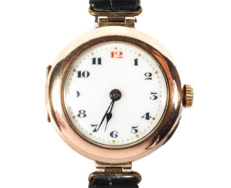 An early 20th century 9ct gold cased Rolex wristwatch, the white enamel dial with Arabic numerals denoting hours, Interior ba
