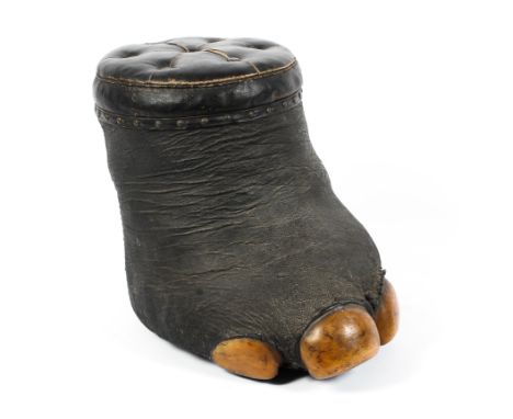 A Victorian taxidermy elephant foot stool, the foot surmounted with a black leather padded seat, height 33cm Condition Report