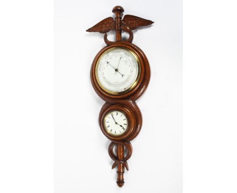 A early 20th century wall clock barometer in a carved oak frame, the circular clock with a white dial and Roman numerals, abo