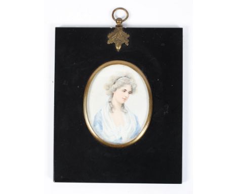 A Georgian style watercolour portrait miniature, of oval form, 20th century, featuring a young woman dressed in blue and look