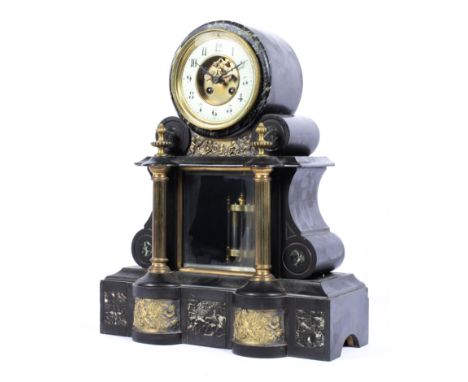 A Victorian slate and marble drum and scroll shaped mantel clock, inset with brass panels depicting putti, the white porcelai